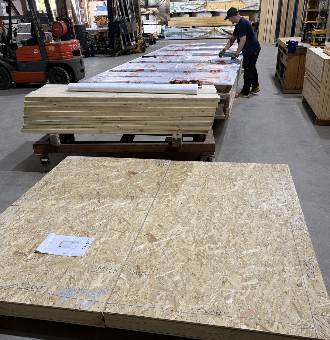 Timber panels being prepared for a sauna build in the workshop